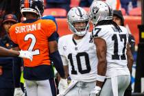 Raiders quarterback Jimmy Garoppolo (10) celebrates the team’s win with wide receiver Da ...