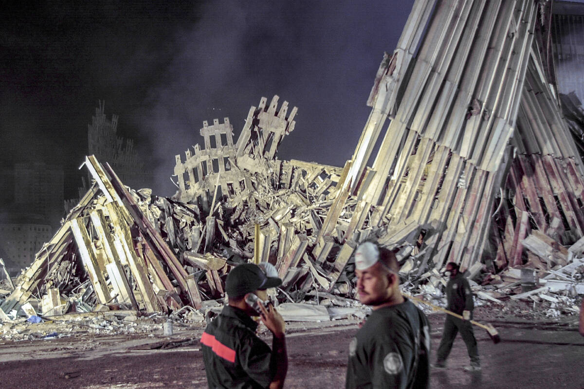 FILE — First responders work at ground zero after the Sept.11 attacks, Sept. 12, 2001, i ...