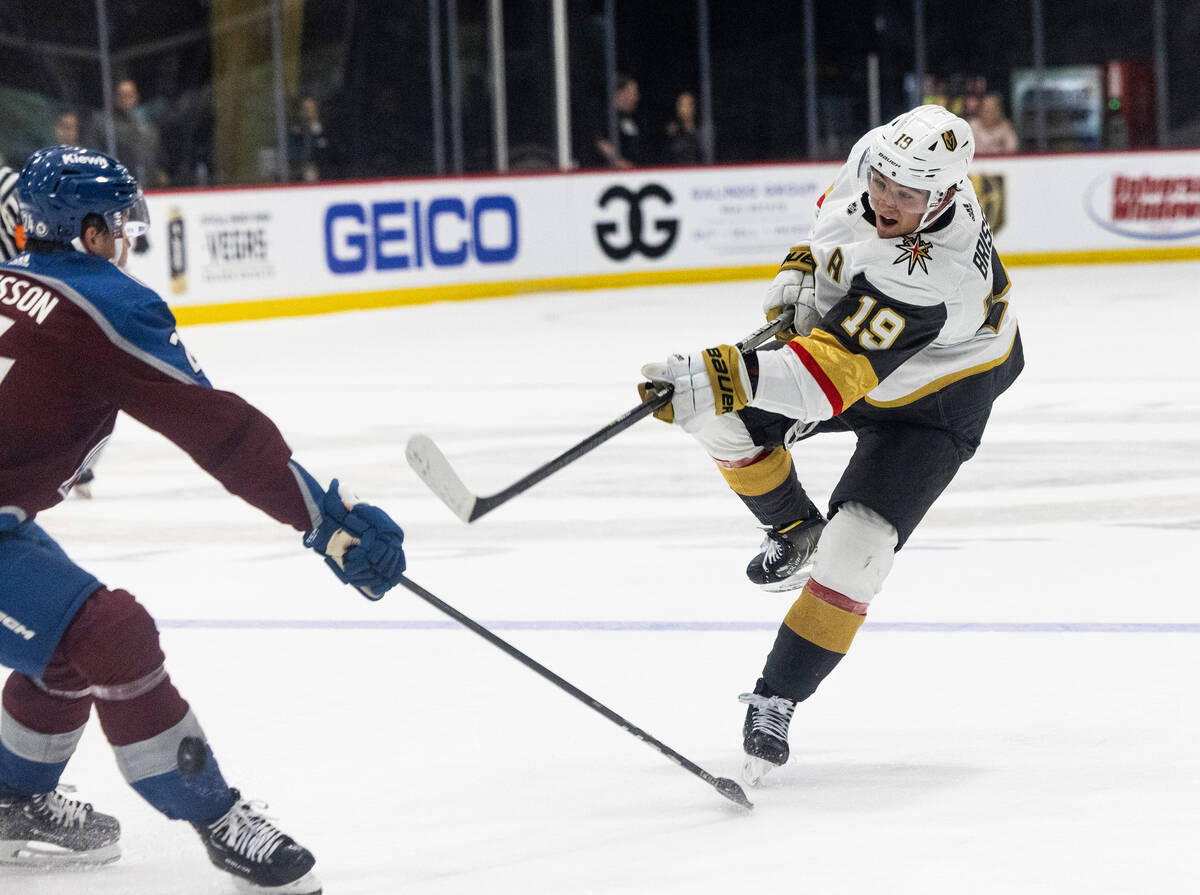 Golden Knights prospect forward Brendan Brisson (19) hits the puck during a rookie camp game ag ...