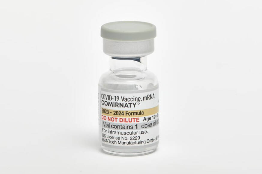 This photo provided by Pfizer shows a single-dose vial of the company's updated COVID vaccine f ...