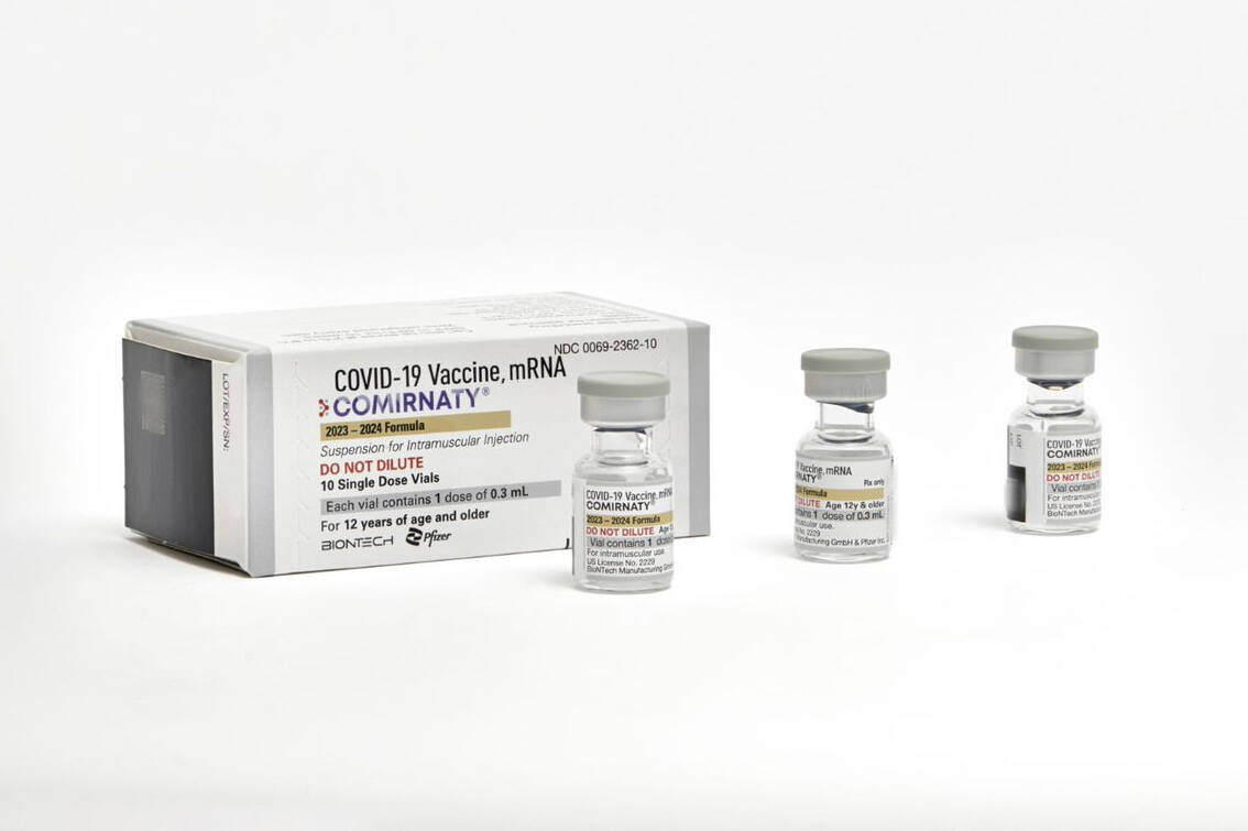 This photo provided by Pfizer shows single-dose vials of the company's updated COVID vaccine fo ...