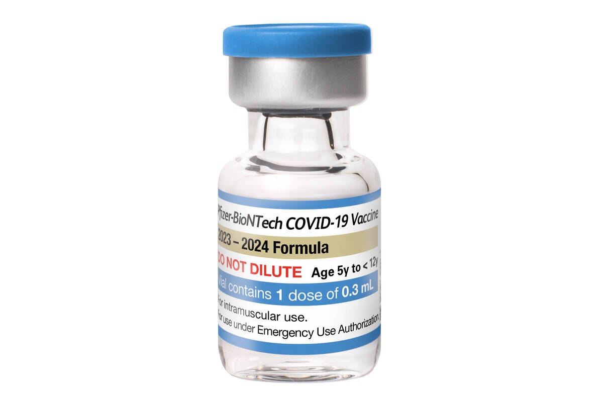 This photo provided by Pfizer shows a single-dose vial of the company's updated COVID vaccine f ...