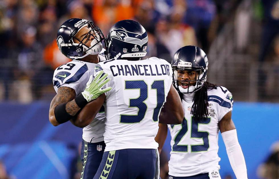 Seattle Seahawks free safety Earl Thomas (29) cebrates with strong safety Kam Chancellor (31) a ...