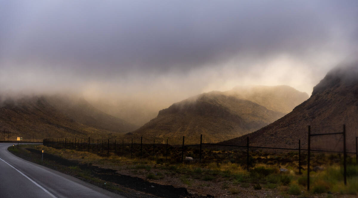 The sun attempts to break through the clouds along Highway 160 nearing Mountain Springs as the ...