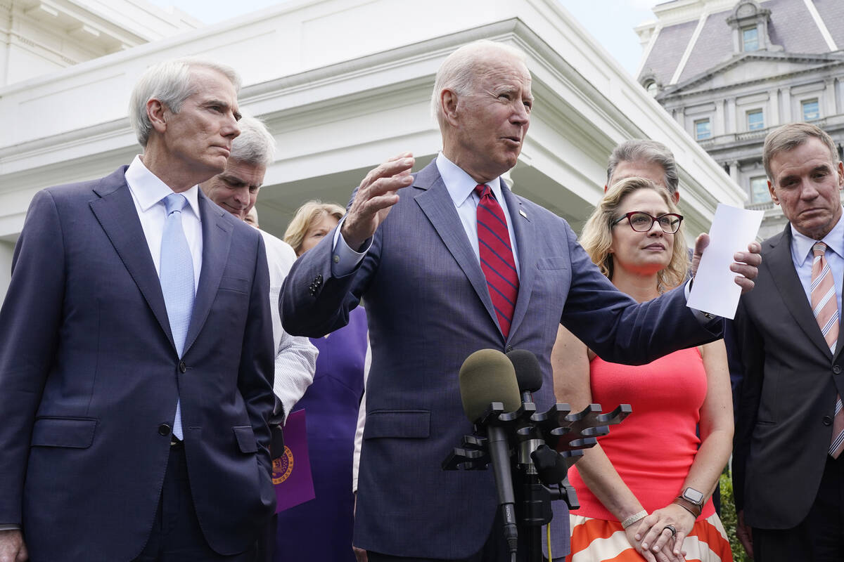 President Joe Biden, with a bipartisan group of senators. (AP Photo/Jacquelyn Martin)