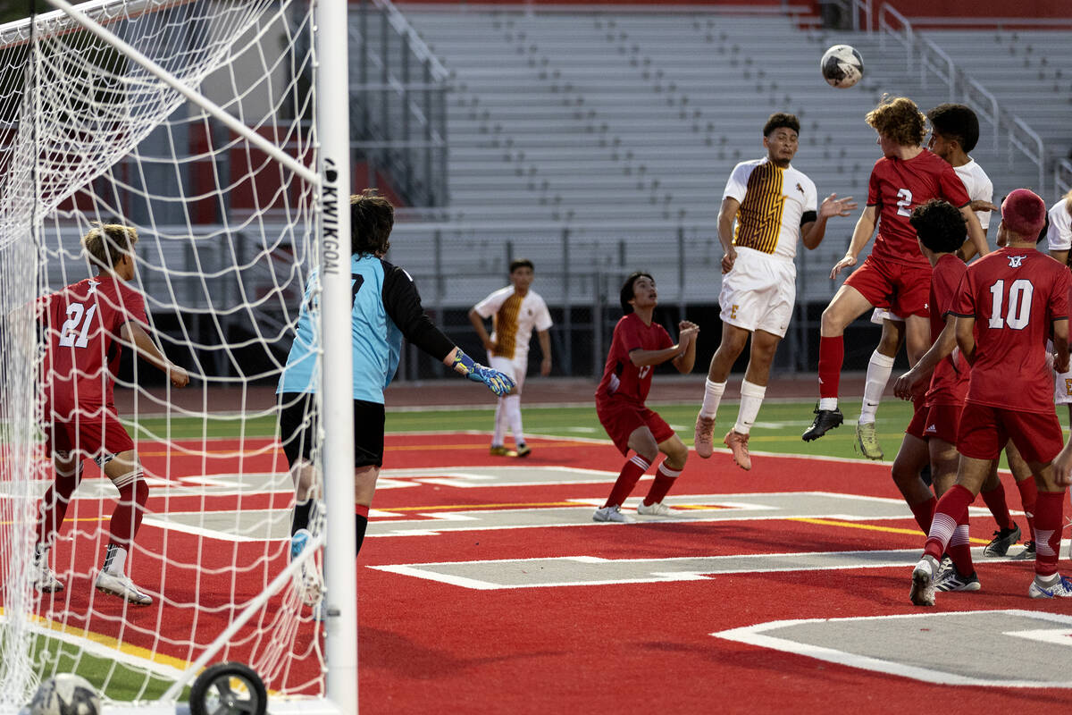 Eldorado midfielder Ángel Reveles (22) goes up for a header Arbor View's Adam Lahav (2) be ...