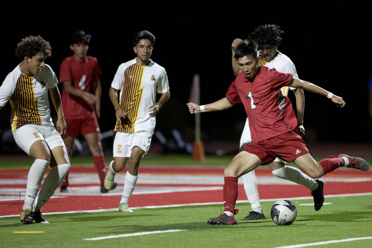Arbor View's Hunter LaPointe (1) winds up for an attempted goal during a boys high school socce ...