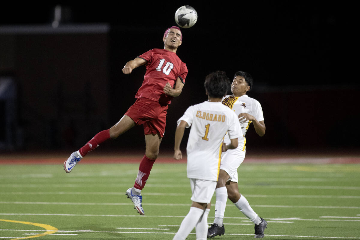 Arbor View's Oziel Gomez (10) gains a header over Eldorado during a boys high school soccer gam ...