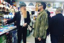 Billy Gibbons and Morris Day are shown at a store in Los Angeles during a break in recording se ...