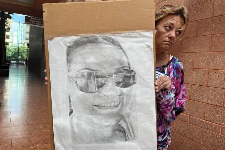 Lois Chase holds a picture of her daughter, Jamie Chase, at the Regional Justice Center on Tues ...