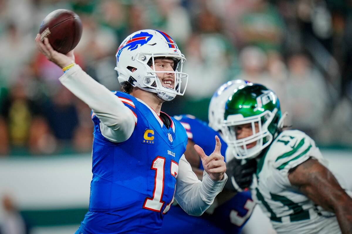 Buffalo Bills quarterback Josh Allen (17) looks to pass during an NFL football game against the ...