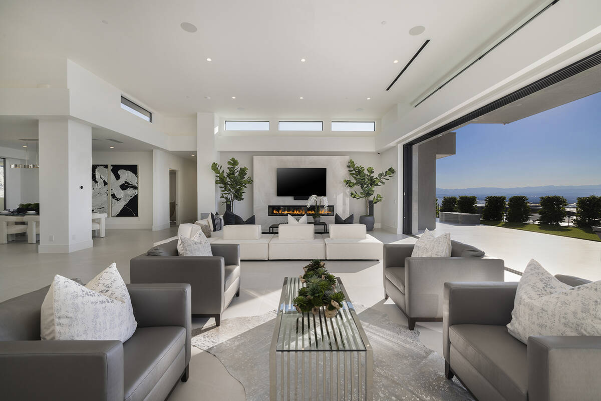 The living room features a modern fireplace. (Douglas Elliman Las Vegas)