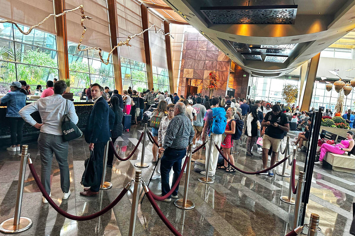 The line to check in at Aria late Wednesday afternoon, Sept. 13, 2023. Staff members were passi ...