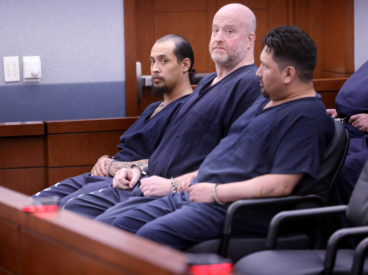 Victor Angel Villanueva, left, waits in court for sentencing at the Regional Justice Center in ...