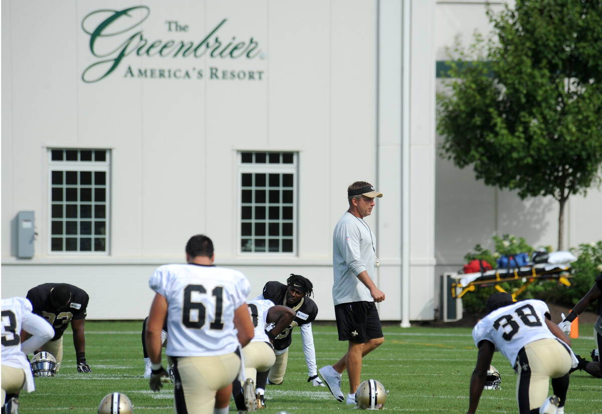 In this Aug. 15, 2016, photo, New Orleans Saints coach Sean Payton walks among the players duri ...