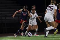 Liberty's Madisyn Marchesi (20) moves the ball under pressure from Desert Oasis' Jessica Leon ( ...
