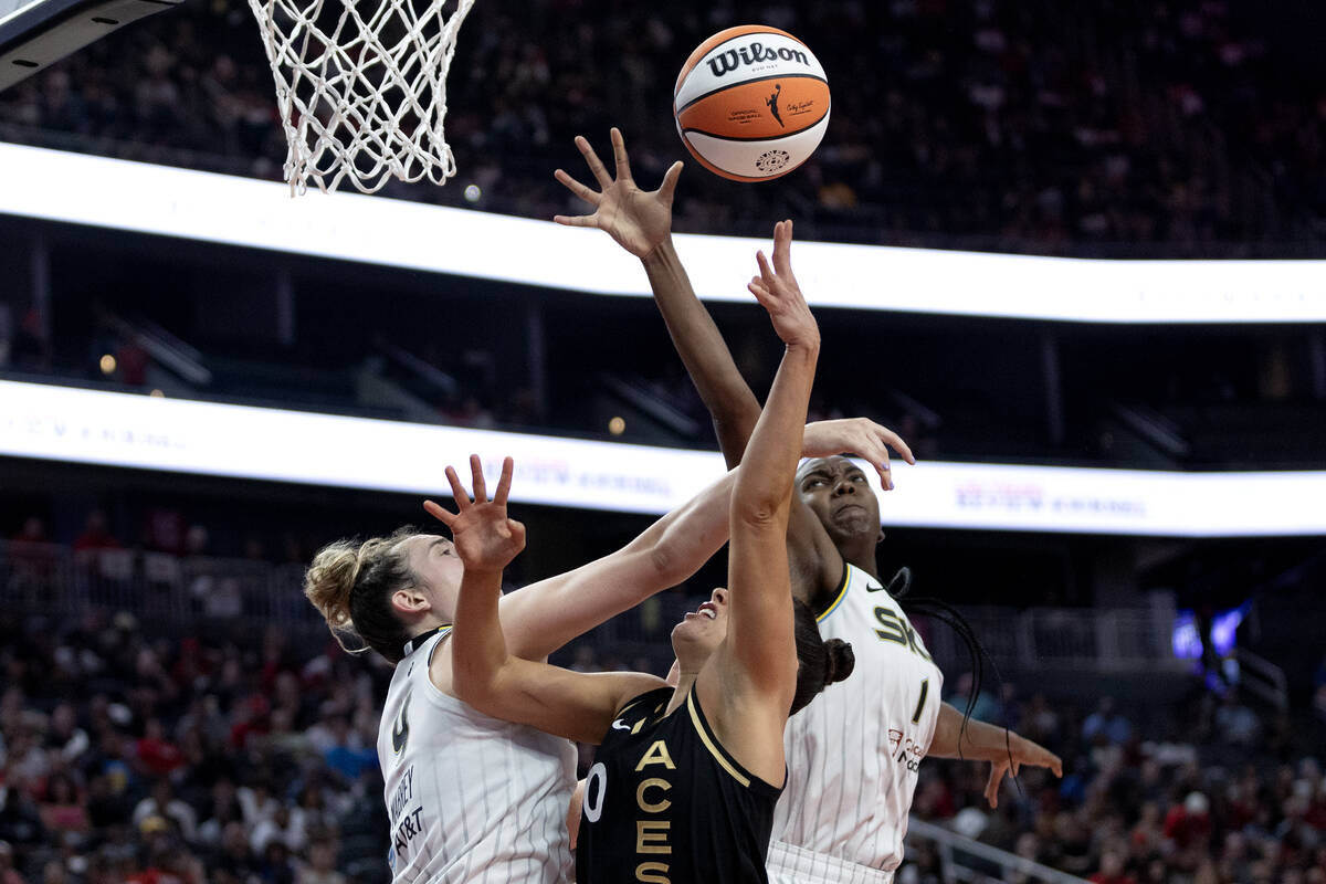 Las Vegas Aces guard Kelsey Plum (10) shoots but is fouled by Chicago Sky guard Marina Mabrey, ...