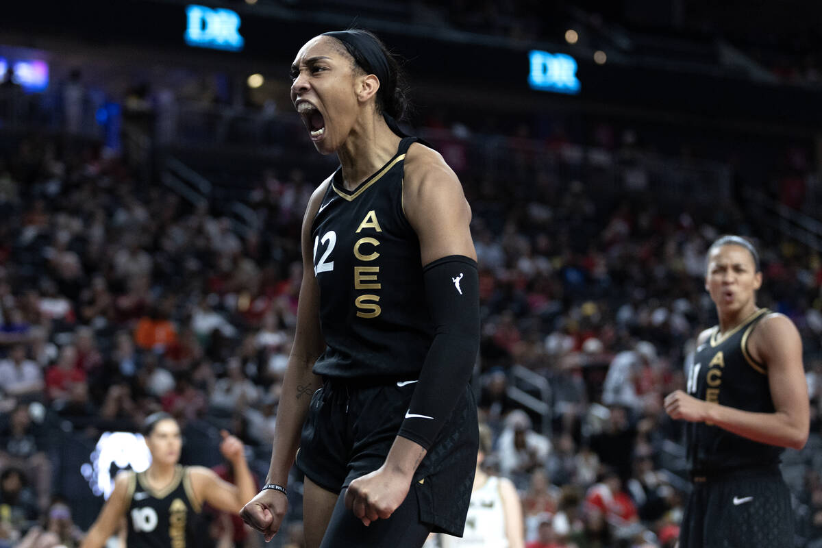 Las Vegas Aces forward A'ja Wilson (22) celebrates after blocking a Chicago Sky shot during the ...
