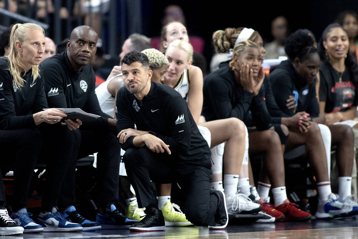 Chicago Sky head coach Emre Vatansever kneels at the sidelines during the second half of Game 1 ...