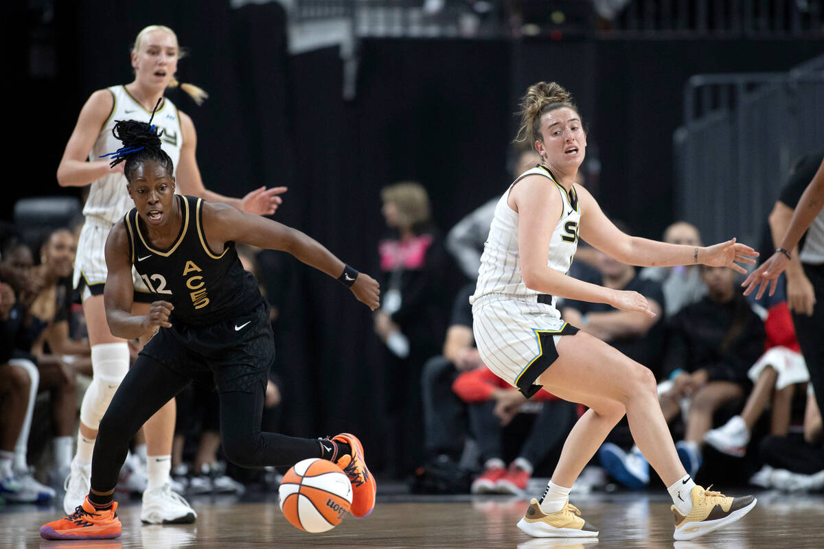 Las Vegas Aces guard Chelsea Gray (12) steals the ball from Chicago Sky guard Marina Mabrey, ri ...
