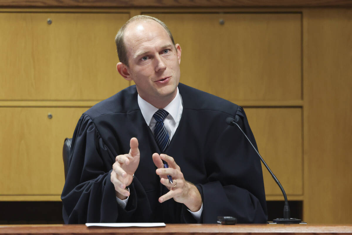 FILE - Fulton County Superior Judge Scott McAfee hears motions from attorneys representing Ken ...