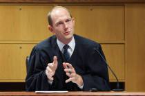 FILE - Fulton County Superior Judge Scott McAfee hears motions from attorneys representing Ken ...