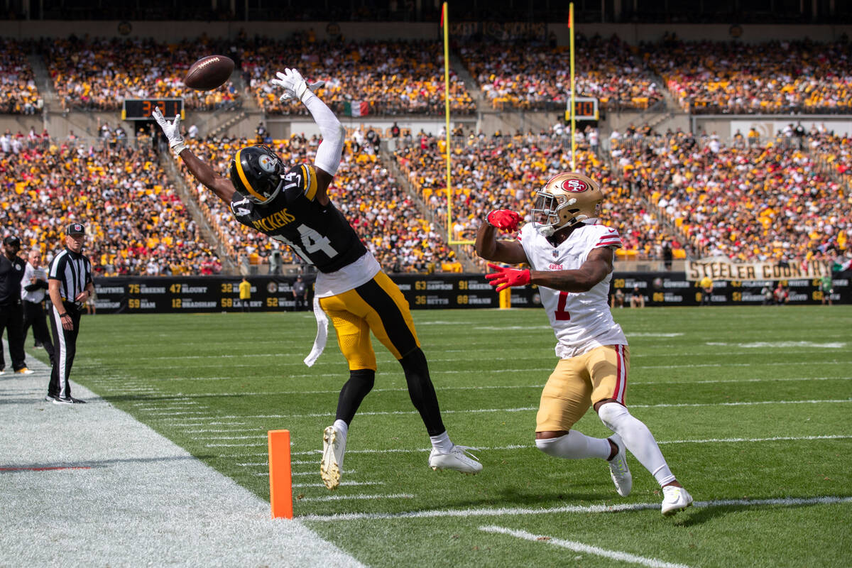 Pittsburgh Steelers wide receiver George Pickens (14) attempts to catch a passing front of San ...
