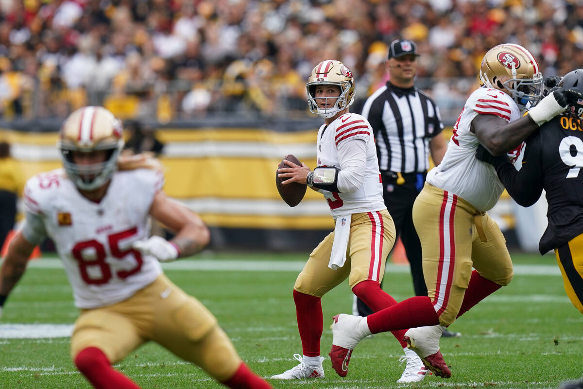 San Francisco 49ers quarterback Brock Purdy (13) looks for a receiver during the first half of ...