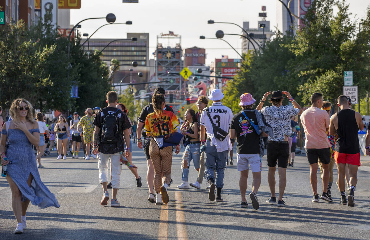 People walk along Fremont Street during day two of Life is Beautiful on Saturday, Sept. 18, 202 ...