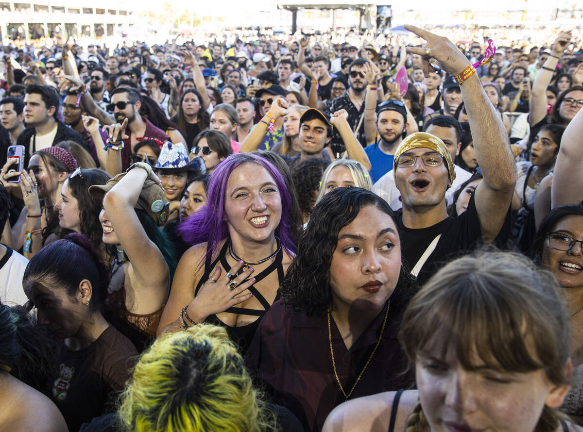 Fans react as Jordan Edward Benjamin, who goes by grandson, performs during the first day of th ...