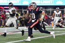New England Patriots quarterback Mac Jones (10) runs for a touchdown in the second half of an N ...