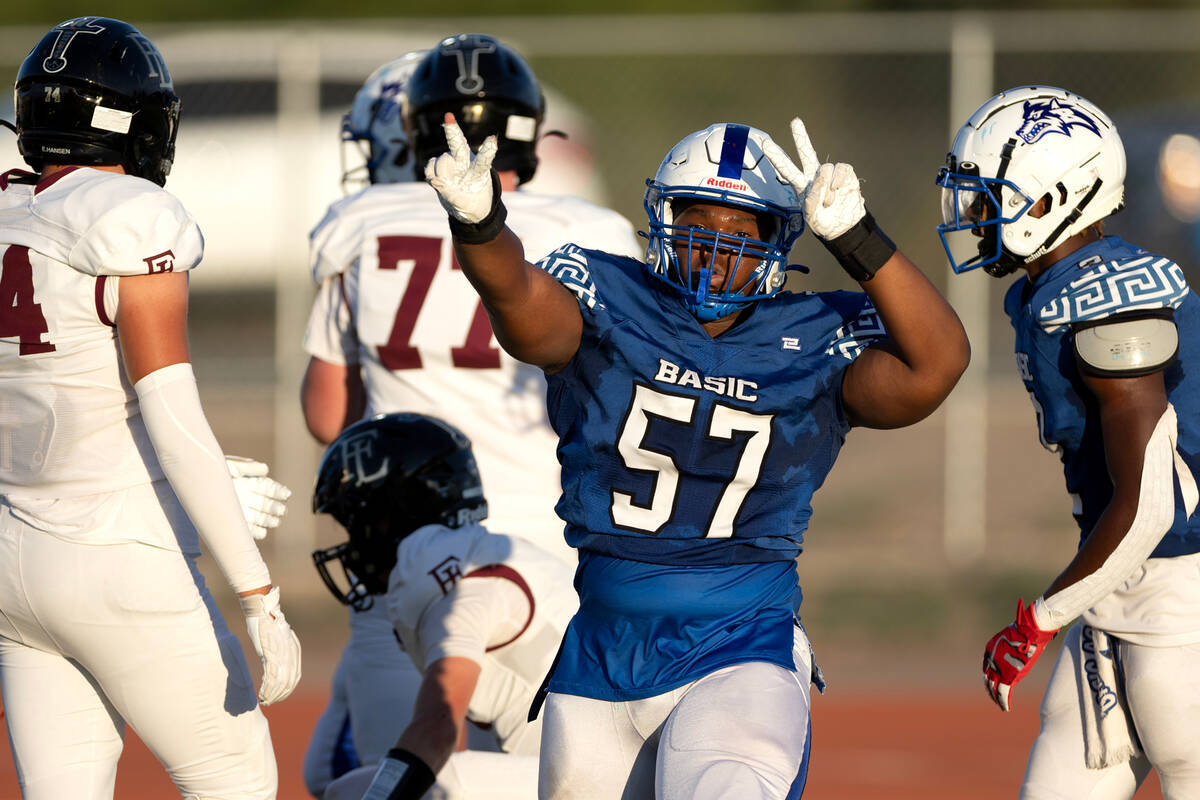 Basic offensive lineman Antoine Taylor (57) celebrates after sacking Faith Lutheran during the ...