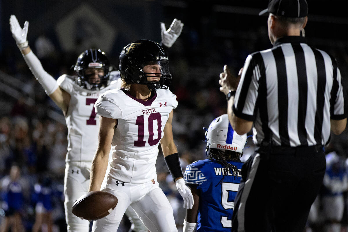 Faith Lutheran quarterback Graham Radke (10) smiles after scoring a game-tying touchdown during ...
