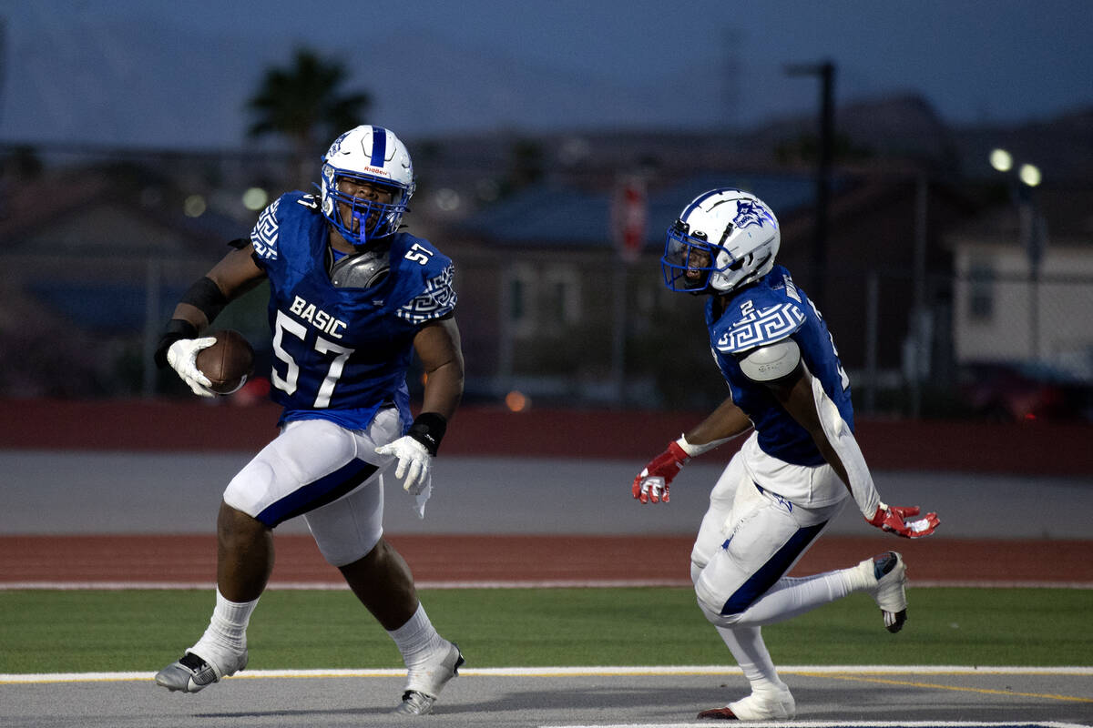 Basic offensive lineman Antoine Taylor (57) and wide receiver Chrey Traylor (2) celebrate Taylo ...