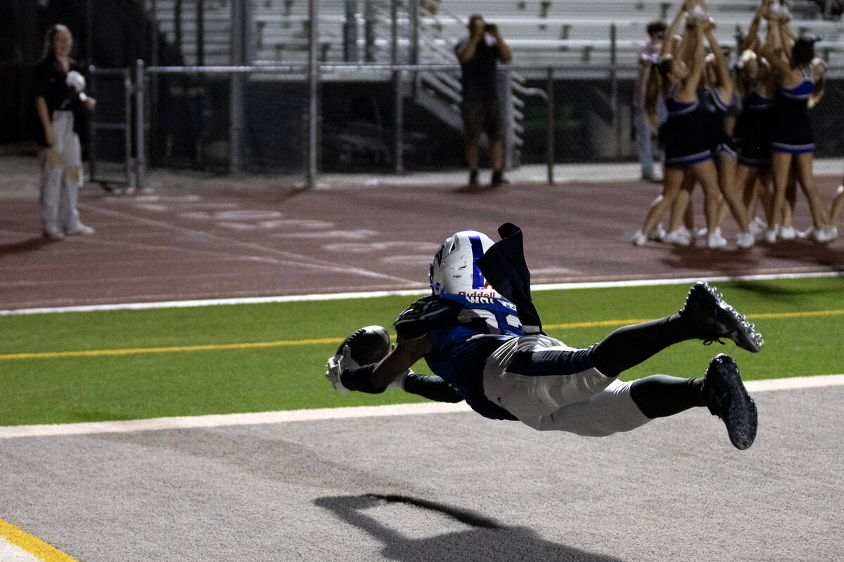 Basic wide receiver Zuri Whiters (23) dives to catch in the end zone during overtime in a high ...