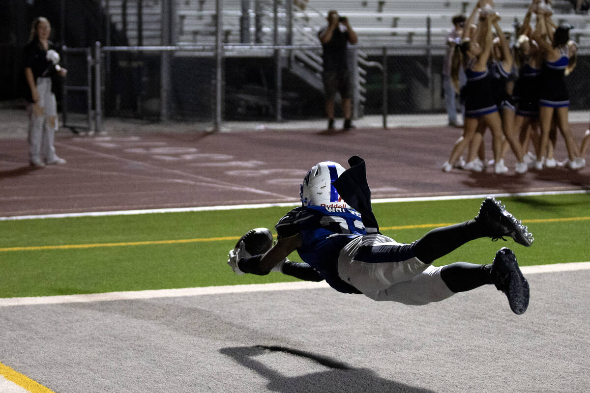 Basic wide receiver Zuri Whiters (23) dives to catch in the end zone during overtime in a high ...