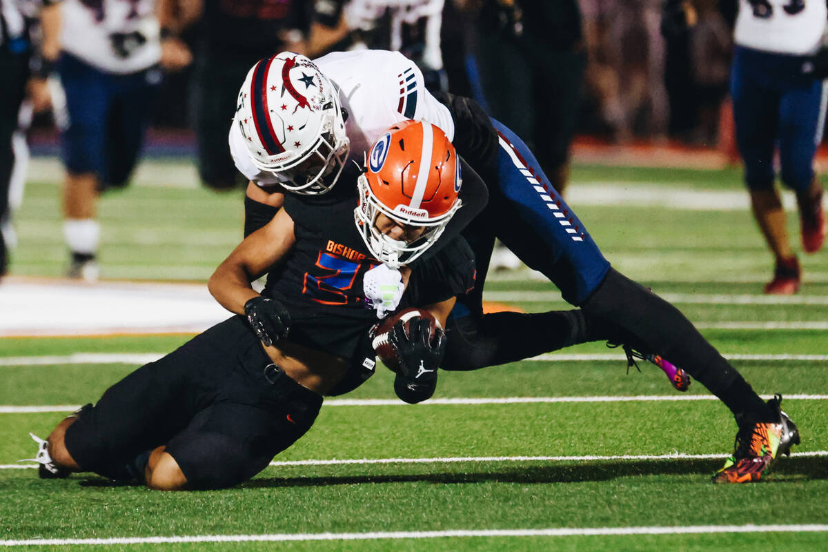 A Bishop Gorman player is tackled to the ground during a game against Liberty at Bishop Gorman ...