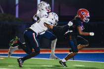Bishop Gorman running back Myles Norman (24) carries the ball to the end zone as Liberty defens ...