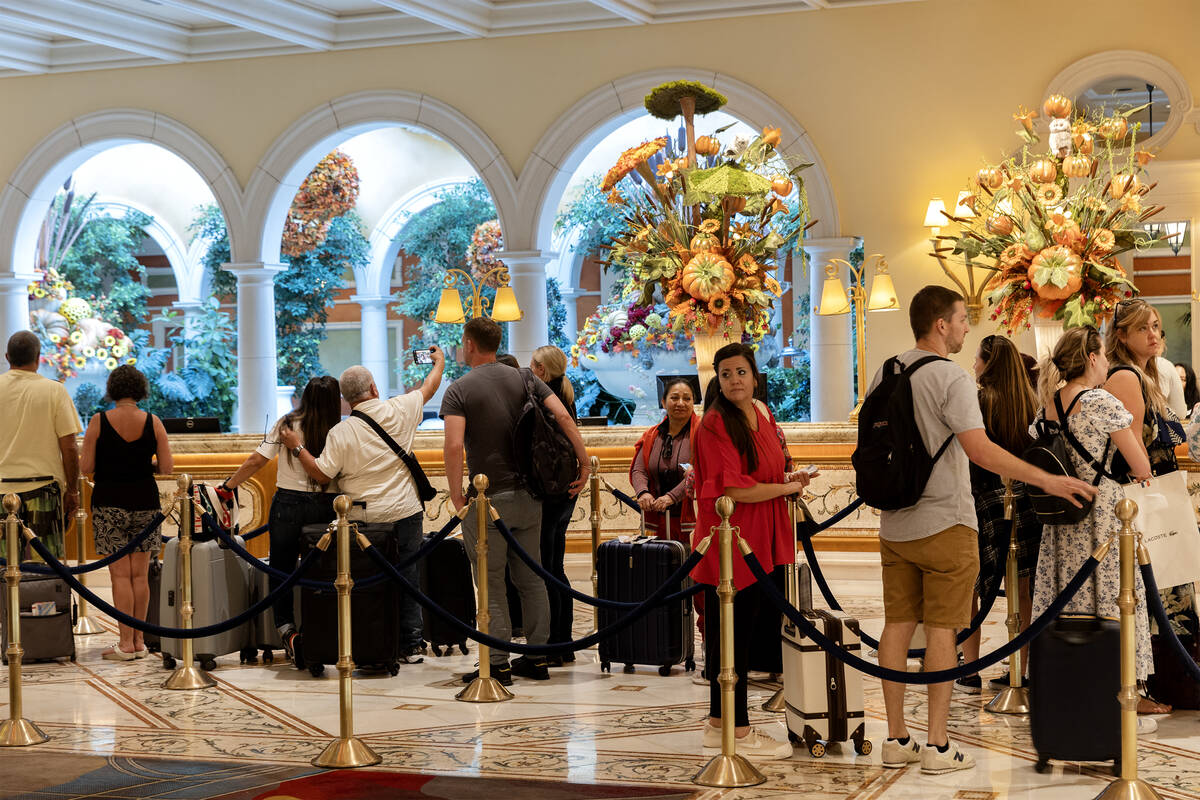 Guests wait to check in at the Bellagio on Friday, Sept. 15, 2023, in Las Vegas. MGM Resorts In ...