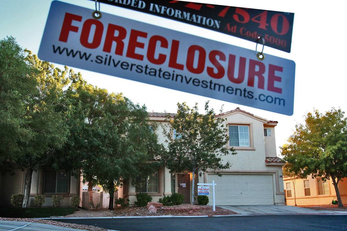 A foreclosure hanger swings from a real estate sign in the North Horn Trail Court neighborhood ...