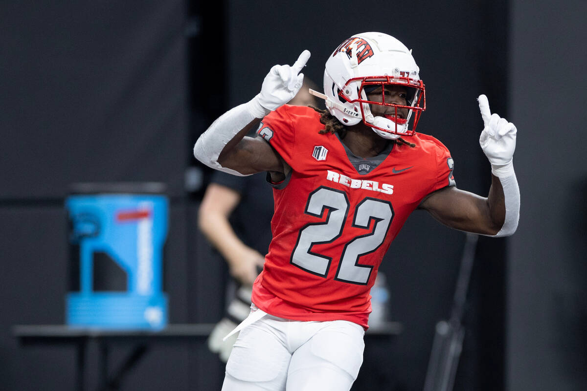 UNLV running back Jai'Den Thomas (22) celebrates after scoring a touchdown during the first ha ...