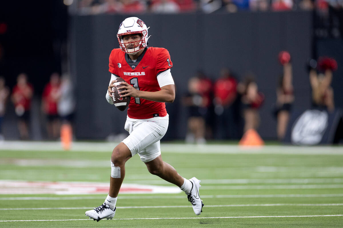 UNLV quarterback Jayden Maiava (1) looks to pass during the first half of an NCAA college footb ...