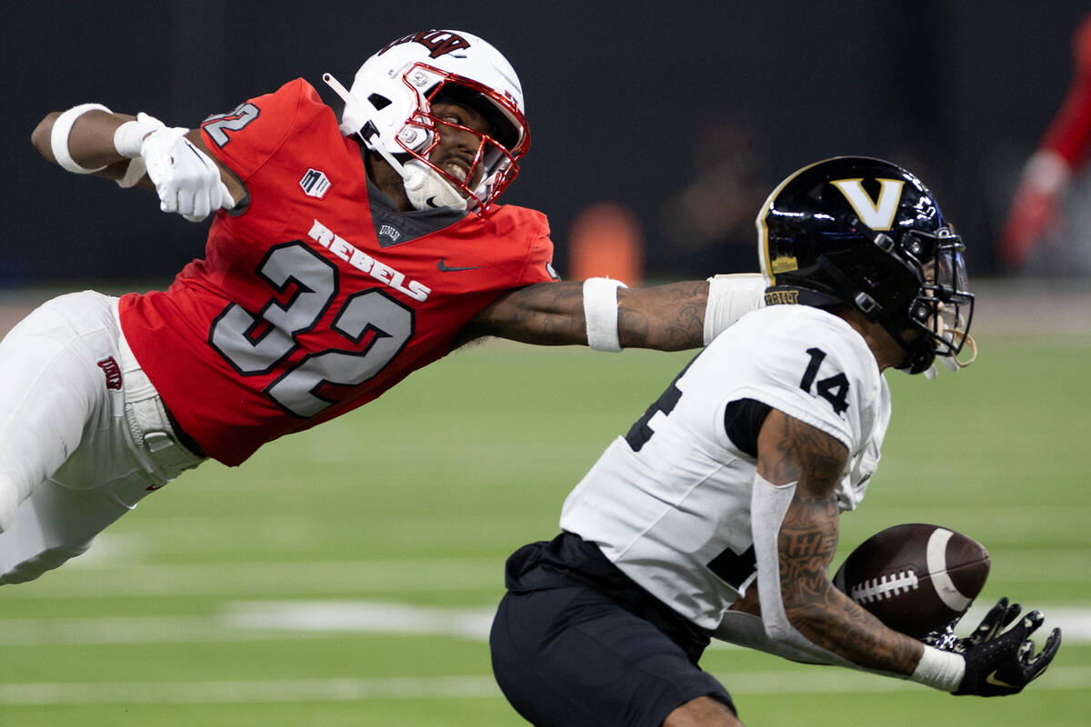 UNLV defensive back Ricky Johnson (32) dives but fails to stop a catch by Vanderbilt wide rec ...