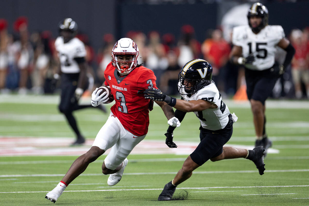 UNLV wide receiver Zyell Griffin (3) runs the ball while Vanderbilt safety John Howse IV (27) ...