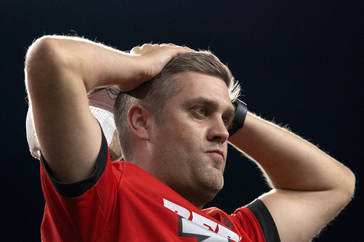 A UNLV fan expresses stress after Vanderbilt caught an interception during the final moments of ...