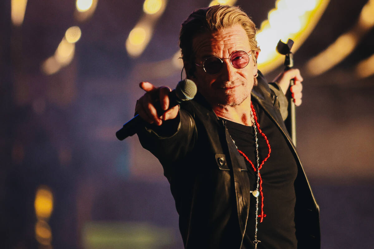 U2 performs while filming a music video in front of the Plaza hotel and casino on Sunday, Sept. ...