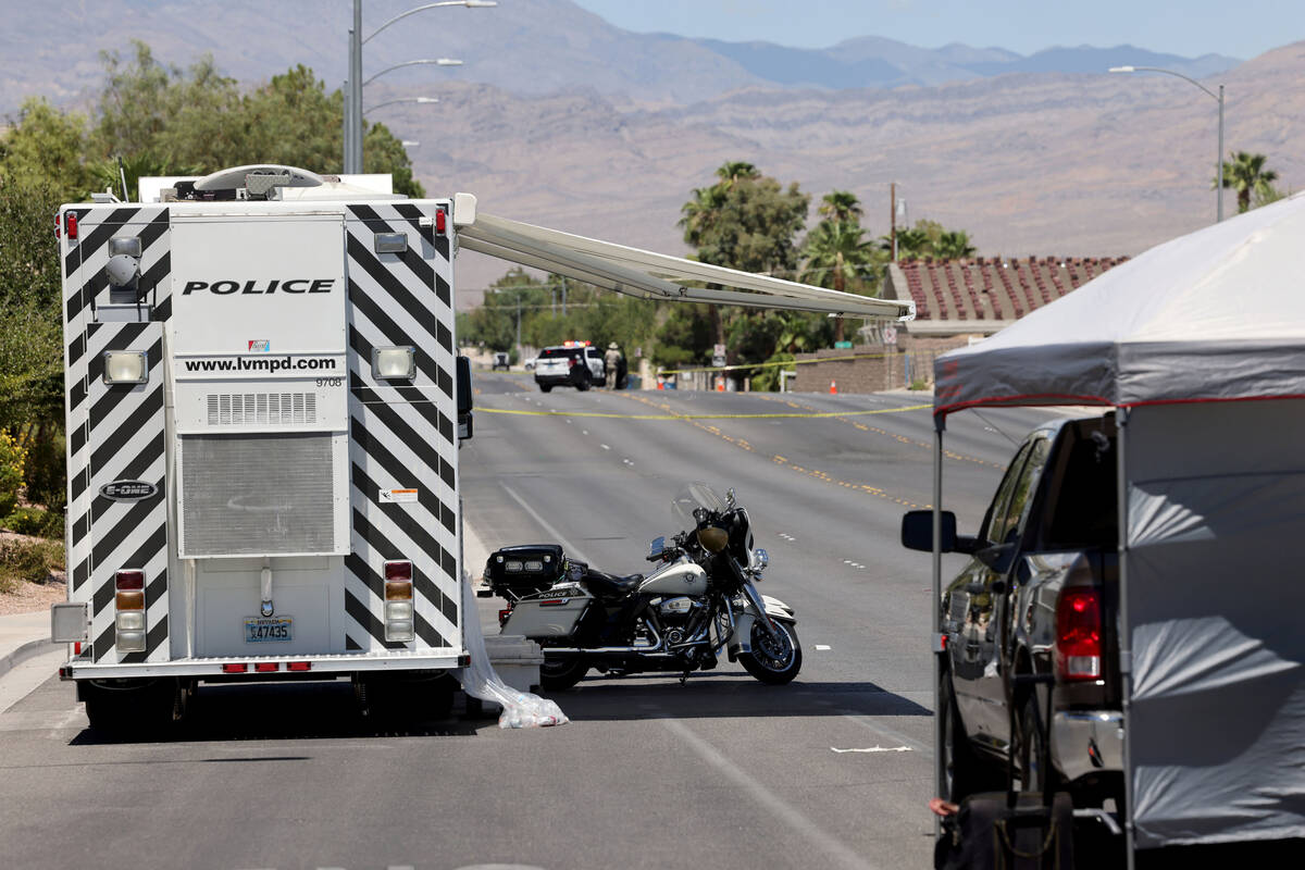 FILE - Las Vegas police investigate the scene of a fatal crash on North Tenaya Way near West Ce ...