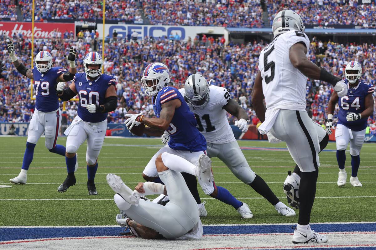 Buffalo Bills wide receiver Gabe Davis (13) catches a pass for a touchdown in front of Las Vega ...