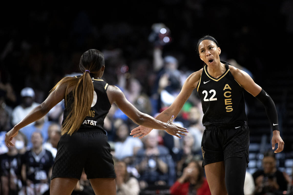 Las Vegas Aces forward A'ja Wilson (22) celebrates with guard Jackie Young (0) after scoring du ...