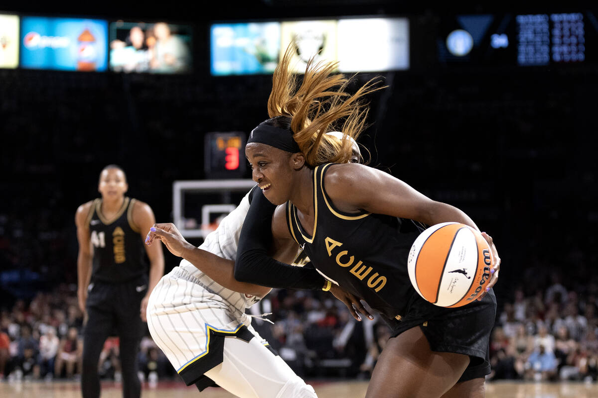 Las Vegas Aces guard Jackie Young (0) tangles with Chicago Sky guard Kahleah Copper, behind, wh ...